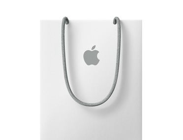 حقيبة تسوق Apple‏ باللون الأبيض ويظهر عليها شعار Apple‏ بالقرب من الجزء العلوي